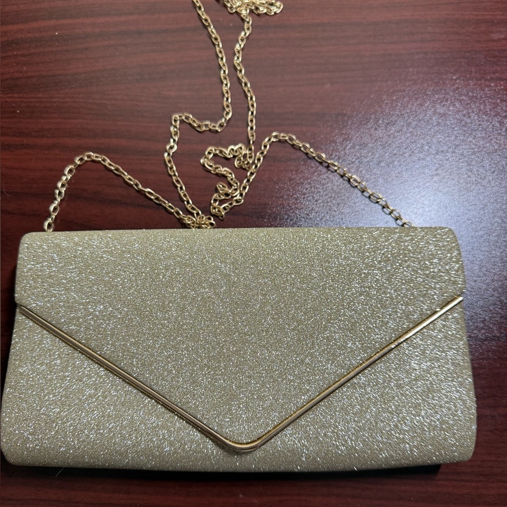 NIB. Elegant Gold Clutch Bag
